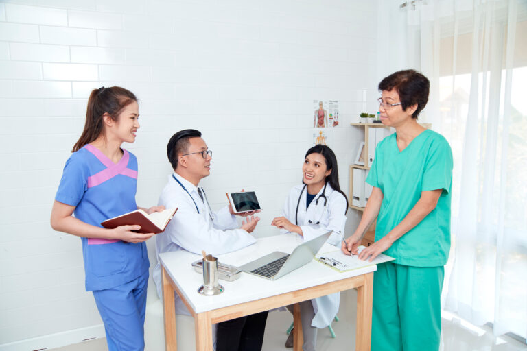 Healthcare professionals collaborating during a meeting, promoting conflict resolution in healthcare.